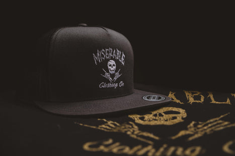 Miserable Charcoal Trucker Hat